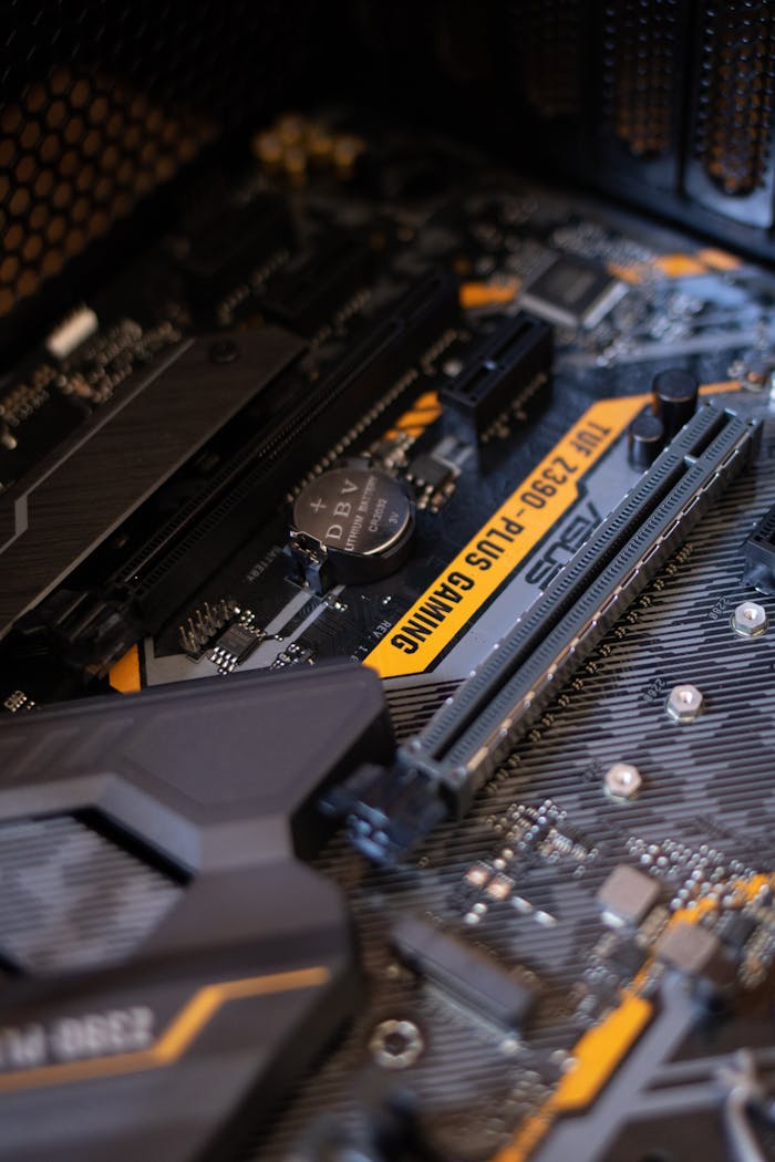 Detailed view of a gaming motherboard with capacitors and microchips.